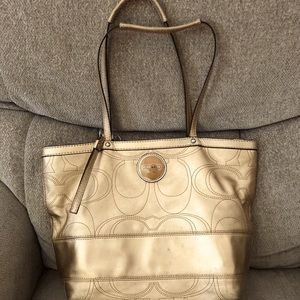 Metallic gold COACH bag
